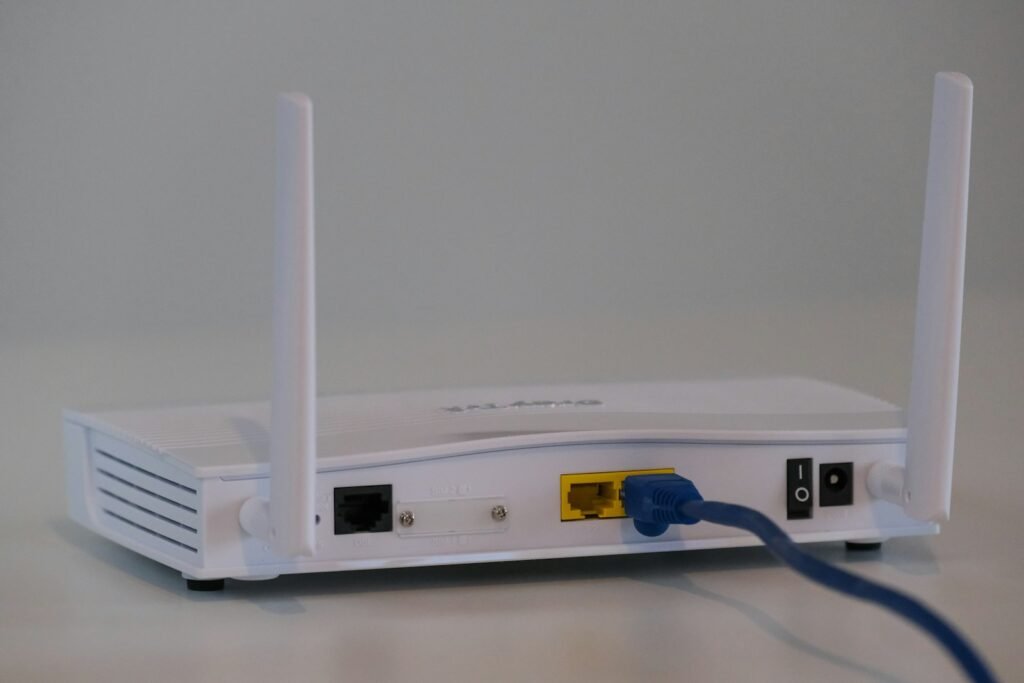 White WiFi router / mesh node on a table